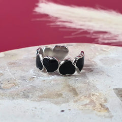 Silver Eternal Hearts adjustable ring with bold black enamel detail. resizeable band, size inclusive design.