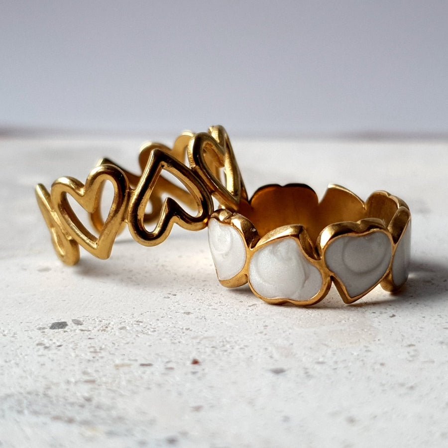 Heart to Heart Ring Bundle from Divine Me Essentials, featuring two silver or gold heart-shaped adjustable rings on a plus-size hand, with a 25% off promotion.