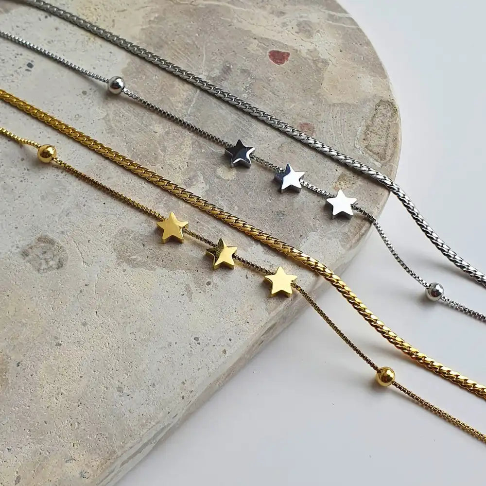 Silver or gold-lated 3 Wishes Necklace featuring three delicate stars, representing hope, dreams, and endless possibilities. Elegant and timeless, designed to complement any outfit.
