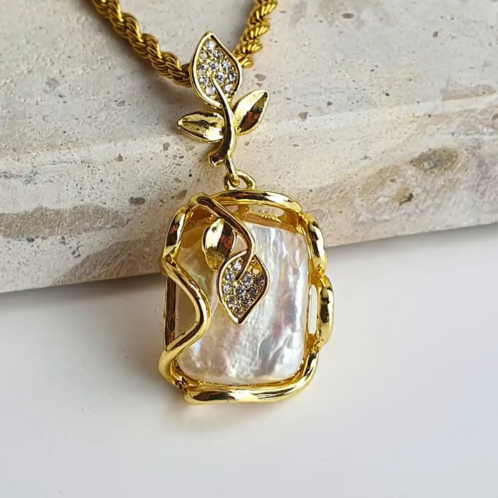 Gold-plated Baroque Pearl Necklace featuring a natural baroque pearl pendant with rhinestones, designed to enhance your natural elegance. Crafted from stainless steel with 18K gold-plating, waterproof, hypoallergenic, and tarnish-resistant.