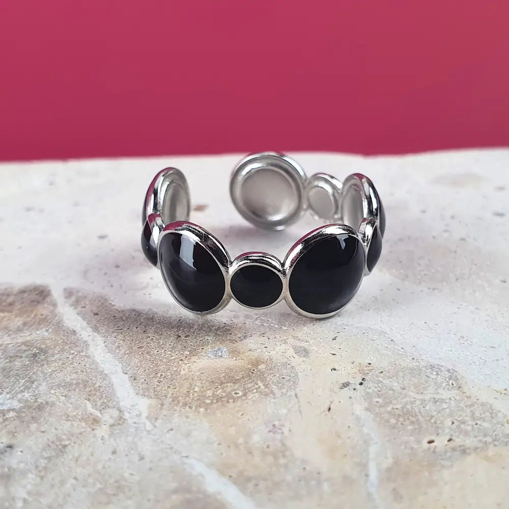 Bubbles adjustable ring in silver stainless steel with black oil dripping and rounded bubble-inspired design