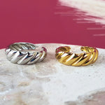 Side-by-side gold and silver crescent-shaped open rings, minimalist and hypoallergenic