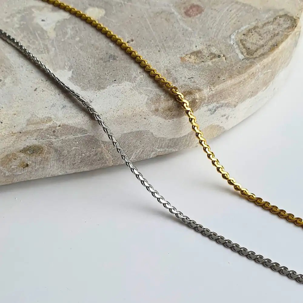 Delicate Twist Chain Necklace available in both 18K gold-plated and classic silver, featuring a simple twist design. Available in 45cm+5cm and 60cm+5cm lengths, perfect for layering or wearing solo.