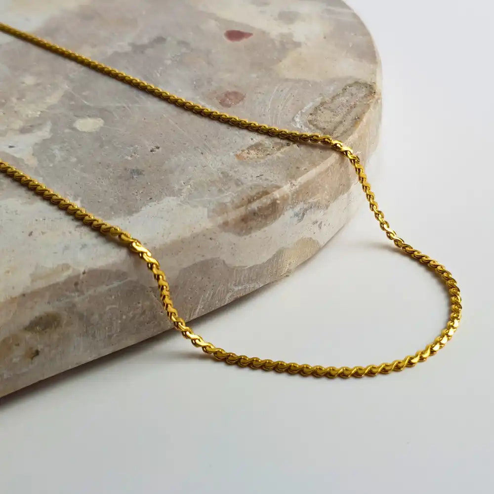 Delicate Twist Chain Necklace in 18K gold-plated featuring a simple twist design. Available in 45cm+5cm and 60cm+5cm lengths, perfect for layering or wearing solo.