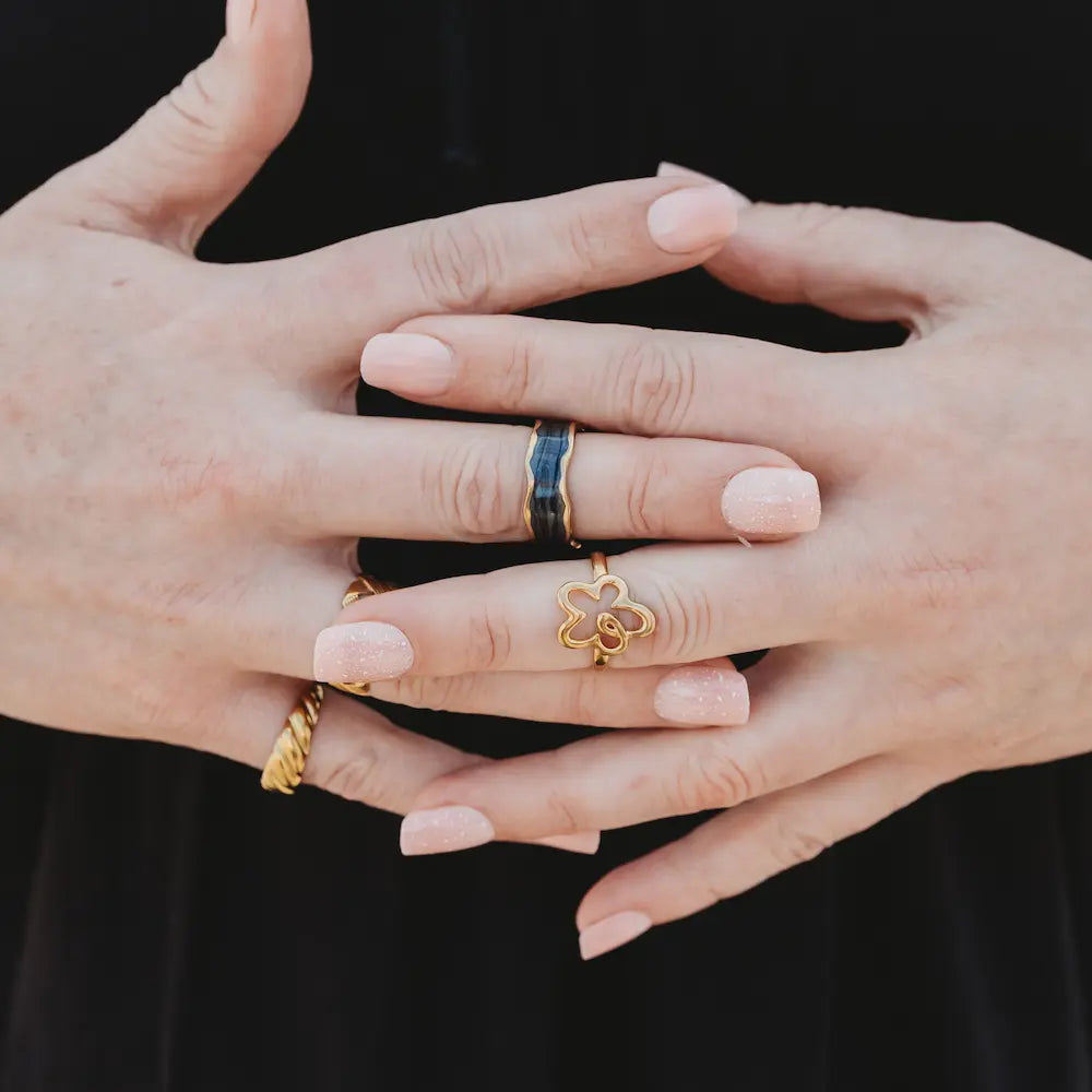 Three is always a vibe. This gold-plated ring stack features a bold mix of Divine Me favourites - waterproof, hypoallergenic, and ready to fit you perfectly.