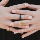 Three is always a vibe. This gold-plated ring stack features a bold mix of Divine Me favourites - waterproof, hypoallergenic, and ready to fit you perfectly.