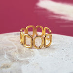 Harmonic shapes adjustable ring in gold on a stainless steel base. Waterproof, hypoallergenic and size-inclusive.