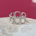 Harmonic shapes adjustable ring in silver on a stainless steel base. Waterproof, hypoallergenic and size-inclusive.