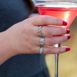 Harmonic rings adjustable ring stacked with criss cross ring and crescent elegence ring. Silver ring stack on midsize womn.