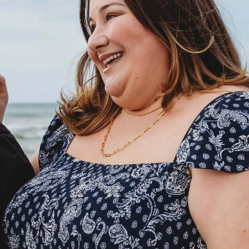 Plus-size woman wearing the 60cm Linked Up Paperclip Chain Necklace in 18k gold plating, featuring bold elongated links for a statement layered look.