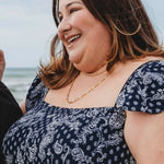 Plus-size woman wearing the 60cm Linked Up Paperclip Chain Necklace in 18k gold plating, featuring bold elongated links for a statement layered look.