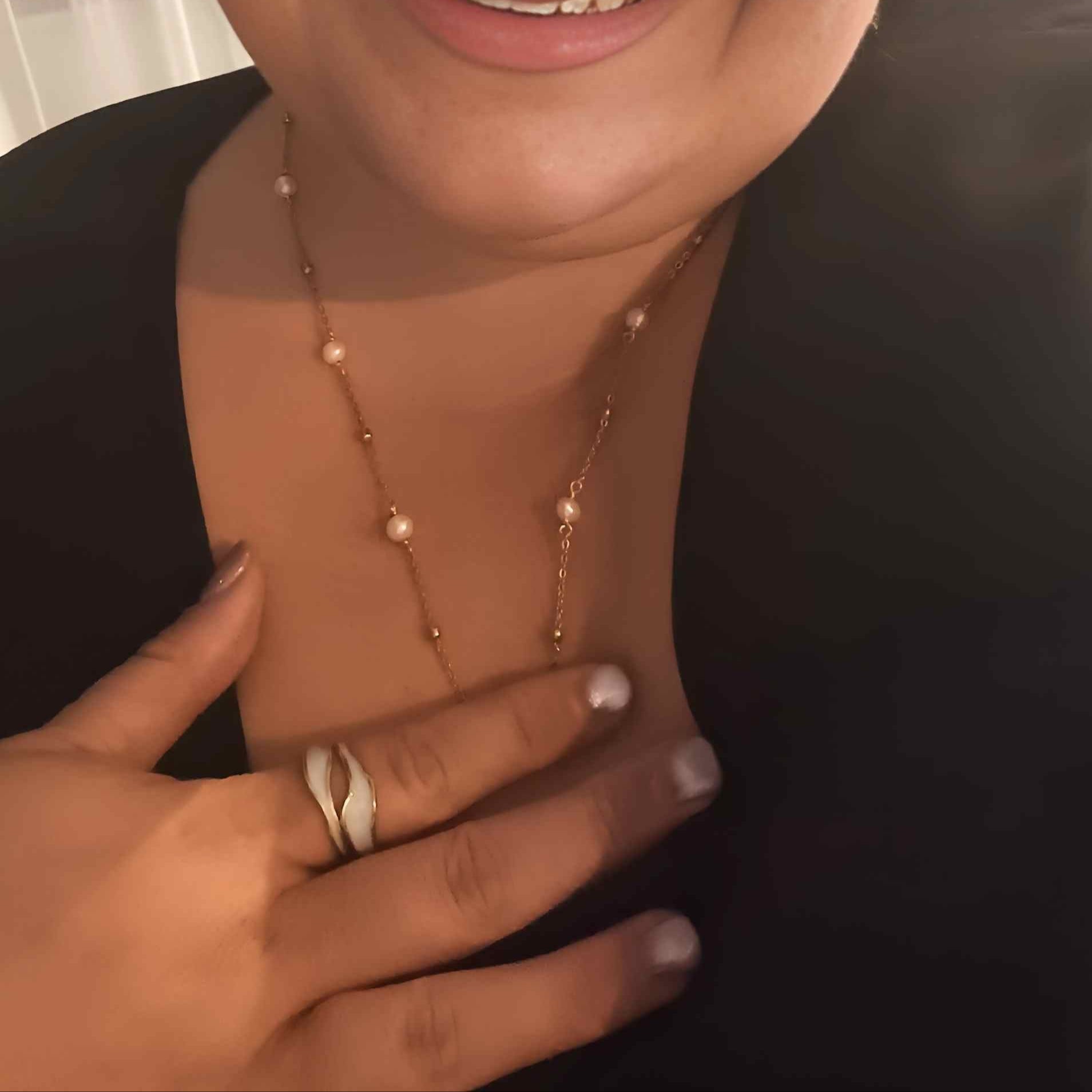 Plus-size woman wearing the Ocean Whispers gold-plated necklace featuring a freshwater pearl on a 60cm chain