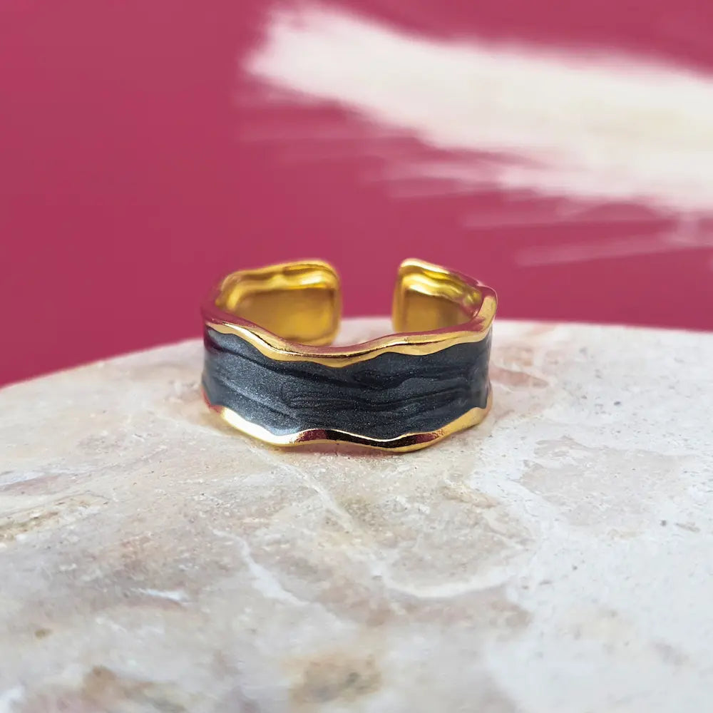 Bold, beautiful, and in gold and black design.  This size 7 gold open ring is waterproof, hypoallergenic, and stunning.
