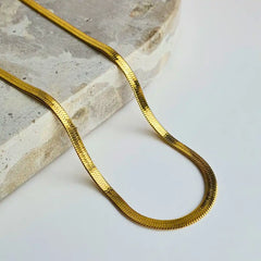 Sleek Snake Chain Necklace in  18k gold plated with a stunning herringbone design. Available in 45cm+5cm and 60cm+5cm lengths. Waterproof, hypoallergenic, and tarnish-resistant.