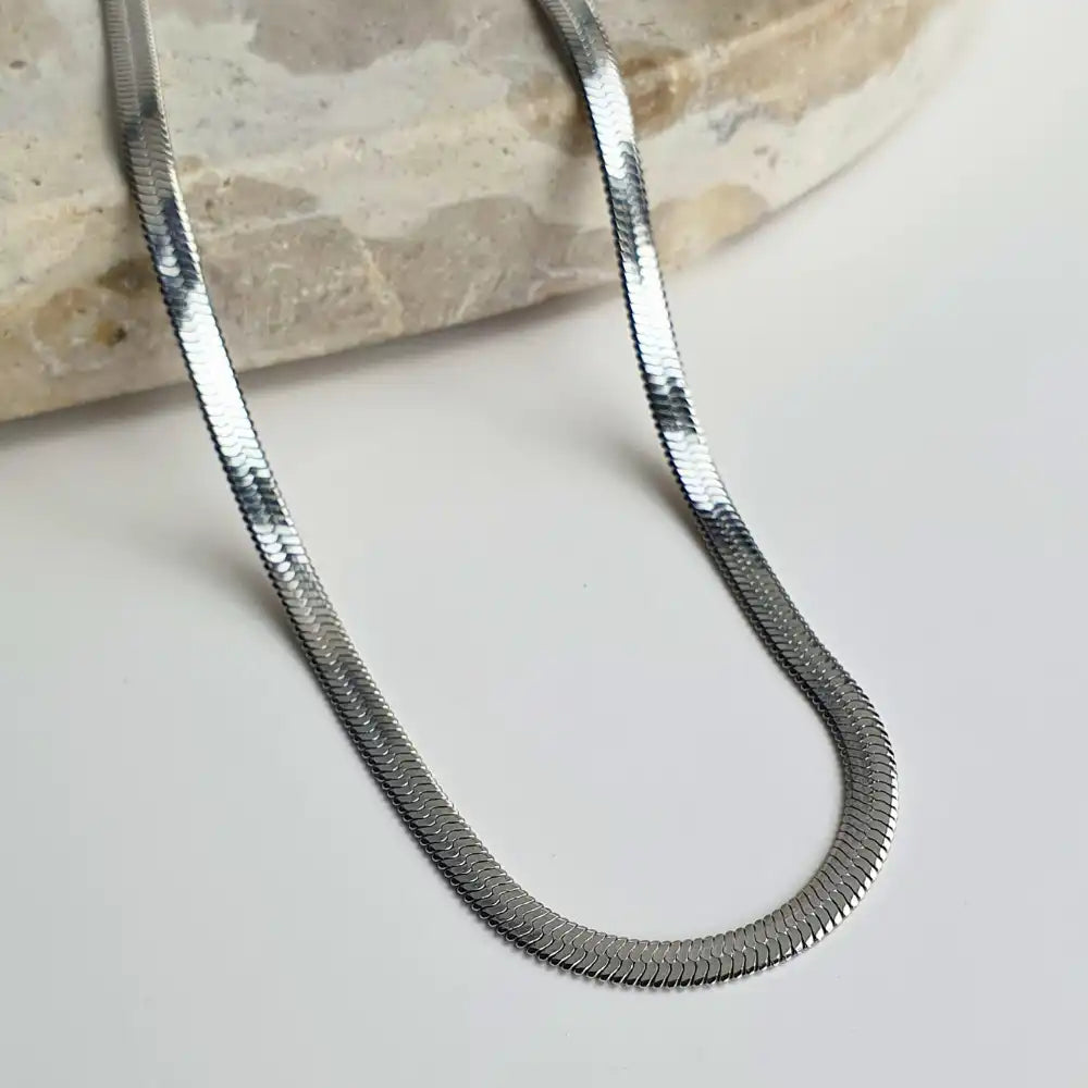 Sleek Snake Chain Necklacein  classic silver with a stunning herringbone design. Available in 45cm+5cm and 60cm+5cm lengths. Waterproof, hypoallergenic, and tarnish-resistant.