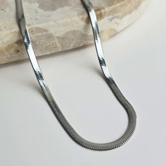 Sleek Snake Chain Necklacein  classic silver with a stunning herringbone design. Available in 45cm+5cm and 60cm+5cm lengths. Waterproof, hypoallergenic, and tarnish-resistant.