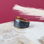 A bold size 9 open ring for women. Waterproof, hypoallergenic, and luxe in gold with black. No green skin. 