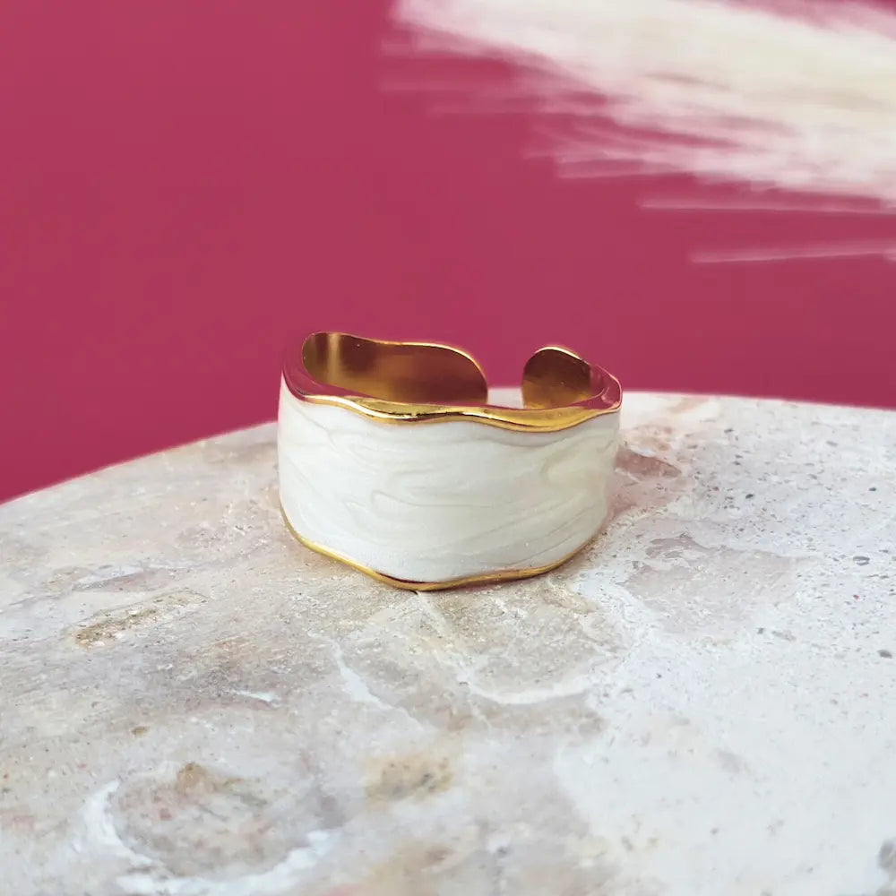 A bold size 9 ring for women. Waterproof, hypoallergenic, and luxe in gold with white. No green skin. 