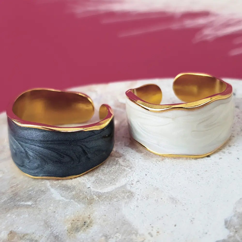 A bold size 9 ring for women who own their power. Waterproof, hypoallergenic, and luxe in gold with white or black oil-dripping. No green skin. No compromises.