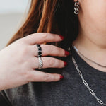 Crescent elegance open ring in silver stacked with my forever love ring in silver and black. Midsize woman. 