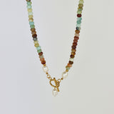 Emerald City Freshwater Pearl Necklace featuring lustrous pearls and a stylish gold toggle clasp, available in 50cm and 60cm lengths. Made with 18K gold-plating for a bold, luxurious look.