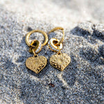 Hypoallergenic gold [;ated Glimmer Hoop Earrings in stainless steel with subtle sparkle and polished finish, perfect for everyday wear