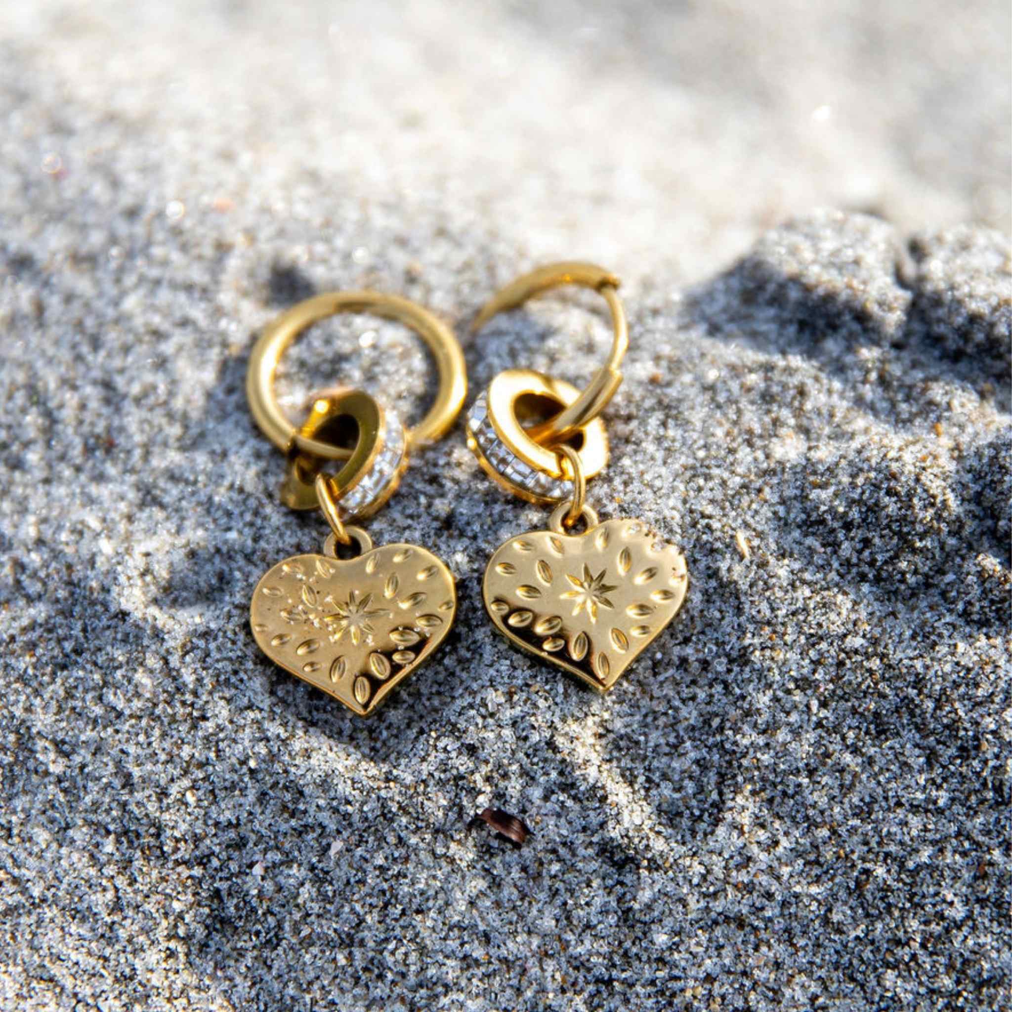 Hypoallergenic gold [;ated Glimmer Hoop Earrings in stainless steel with subtle sparkle and polished finish, perfect for everyday wear