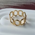 Harmonic shapes adjustable ring by Divine Me Essentials in 18k gold plated on stainless steel base.