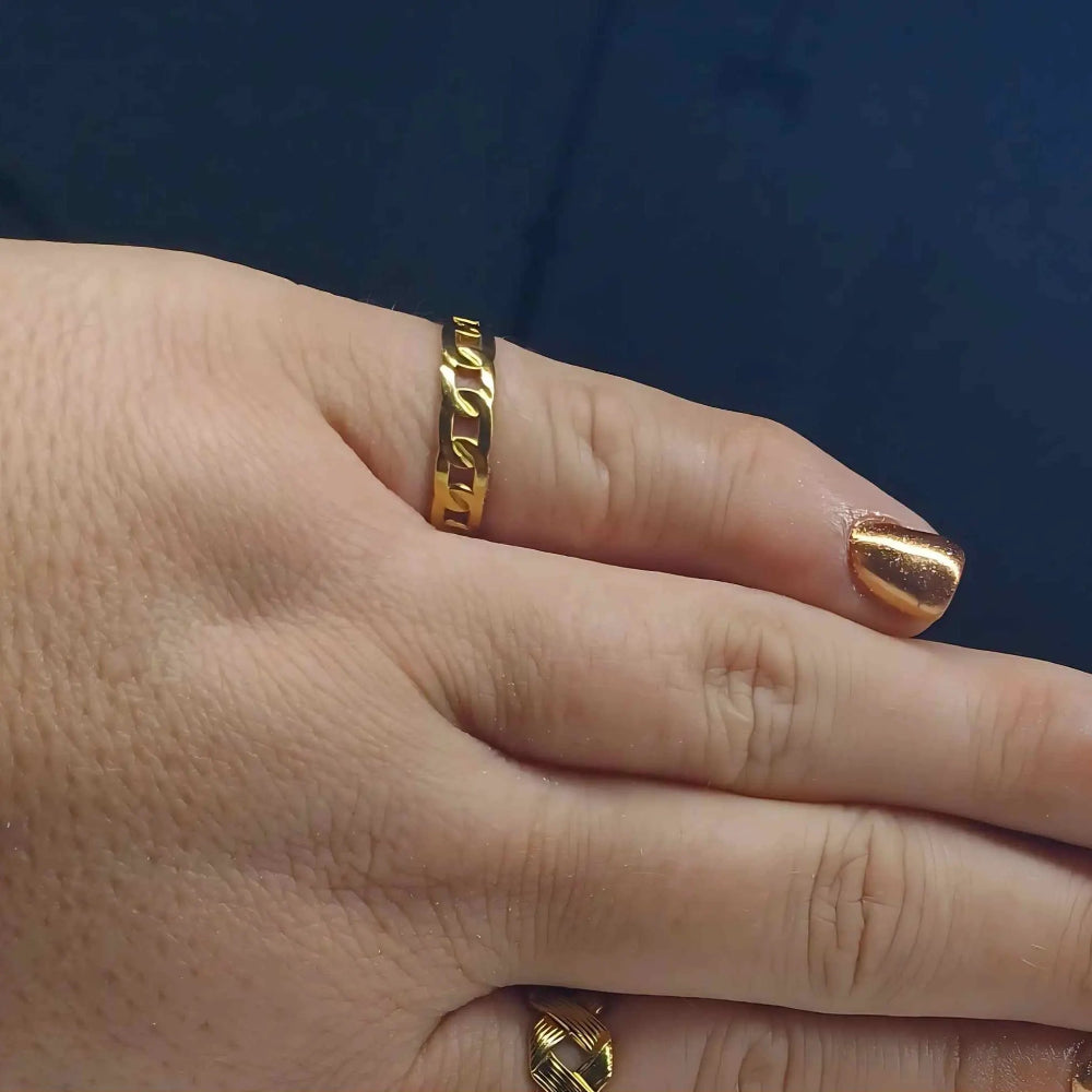 Woman wearing a gold-plated linked chain ring with adjustable fit and bold interlocking design, also comes in silver